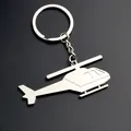 Polierter silberner Hubschrauber-Schlüsselanhänger aus Zinklegierung auf schwarzem Grund - Hubschrauber-Stil / Silber