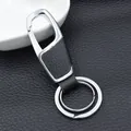 Premium black leather and silver metal keychain with spring hook and dual rings - Nickel