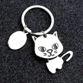 Minimalist silver metal kitten keychain with a round ring and oval tag on black background - Movable Cat Style