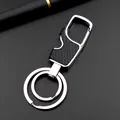 Detailed view of dual-ring metal keychain featuring a bottle opener and honeycomb texture - Black