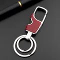 Silver metal keychain bottle opener with red honeycomb texture and dual ring detail - Brown