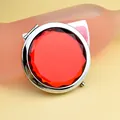 Portable round silver folding makeup mirror with a large faceted red gemstone top - Red