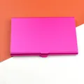 Close-up of a matte magenta aluminum business card holder with mechanical buckle - Rose Red
