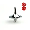 Close-up of a polished silver metal spinning top with red dice on a white background - Silver And Dice