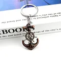 Vintage bronze nautical keychain featuring a spinning anchor and steering wheel charm - No Tag Style / Copper