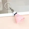 Detailed view of creative pink shuttlecock keychain with a white head and silver metal ring - Pink Style (A-006)
