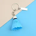 Close-up of blue shuttlecock keychain with polished silver metal ring and engravable tag - Blue with Long Tag Style (A-006)