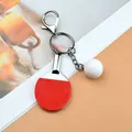Detail of red table tennis racket keychain showing textured rubber and silver metal ring - Red Lobster Clasp Style / Red