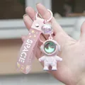 Pink astronaut keychain with silicone strap and glowing space pendant for backpacks - Sunset Lamp Astronaut-Pink