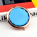 Portable rose gold makeup mirror featuring a large sky blue faceted crystal top - Navy Blue