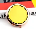 Portable rose gold makeup mirror featuring a large yellow crystal faceted gemstone - Yellow