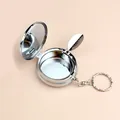 Portable silver round metal pocket ashtray with keychain and flip-open leaf holder - Style With Keychain