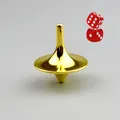 Polished gold metal spinning top toy with two red transparent dice on gray background - Gold And Dice