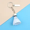 Miniature white badminton shuttlecock keychain with metal tag on blue background - White with Long Tag Style (A-006)