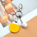 Miniature sports keychain with yellow table tennis racket and white ball pendant - Yellow Lobster Clasp Style / Yellow