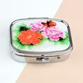 Portable silver metal pill box featuring pink peony flowers and butterfly pattern - Peony Pattern