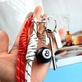 Keyring set with No. 8 pool ball, red white braided strap, and silver bottle opener - Red And White Cord With Tag