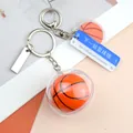 Basketball Schlüsselanhänger aus Acryl mit transparenter Kugel und blauem Schild - Basketball mit Schild Nächste Station und langer Anhänger