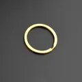 Minimalist circular gold-plated metal key ring with split opening on dark background - 32mm Flat Ring / Gold