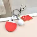 Miniature table tennis racket keychain with white ball and national flag charm - Red Ping Pong With Flag Lobster Clasp Style