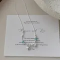 S925 silver necklace with sea star shell charms and light blue beads detail - Crystal Style
