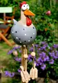 Garden chicken figurine with black dots and long hanging legs on a wooden table - Sky Blue