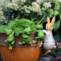 Garden resin ornaments set featuring three frogs and a rabbit hanging on flower pots - Frogs and Rabbit Collection