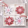 Christmas wooden snowflake pendants in red and white colors within a wooden storage box - Christmas Snow