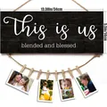 Black wooden This Is Us photo board with mini clothespins and twine hanger for home decor - This Is Us Slogan