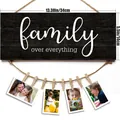 Black wood grain photo display board with 'family over everything' text and 7 clips - Family Slogan