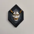 White resin Hannya mask relief with gold horns in a black hexagonal wall frame - White