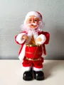 Animated drumming Santa Claus toy in classic red suit with golden drum for Christmas - Electric Drumming Santa With Music