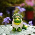 Mini green triceratops hatching from eggshell resin garden statue ornament - Pipi Dinosaur (Green)