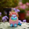 Mini blue dinosaur hatching from a pink cracked eggshell resin desk ornament - Benben Dinosaur (Blue)
