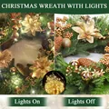 Golden Christmas wreath with pine needles, LED lights, sequins, and cones on dark background - With Lights / 50cm / Gold