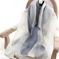 Elegant gradient silk wool scarf in grey and beige hanging on a vintage wooden chair - 190cm / Grey Gradient