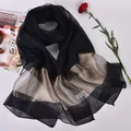 Elegant 100% silk shawl with black and gold stripes on decorative background - Black