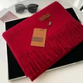Solid deep red faux cashmere scarf with fringe tassels and a leather brand patch - Burgundy