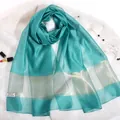 Elegant lake green 100% silk scarf with metallic stripes on white faux fur background - Lake Blue
