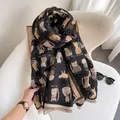 Detail of black cat print scarf with soft tassels and premium cashmere-like texture - Black