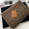 Solid coffee brown cashmere-feel scarf with elegant fringes and branded leather tag - Coffee