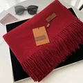 Solid deep red faux cashmere scarf with fringe details and leather brand label - Burgundy