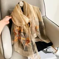 Detail of champagne silk wool shawl with orange floral embroidery and sequin embellishments - 195cmx70cm / Champagne