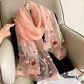 Detail showing pink silk wool scarf with 3D floral embroidery on translucent fabric - 195CM / Pink