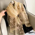 Elegant champagne silk wool scarf with intricate floral embroidery and sheer texture - Champagne