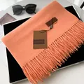 Solid coral orange cashmere-style scarf featuring soft tassels and a leather brand label - Extended Version / Sunstone