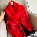 Detailed view of red silk wool scarf with 3D floral embroidery and bead accents - 195CM / Red