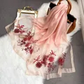 Close-up of pink silk wool shawl with delicate floral embroidery and satin texture - 195CM / Pink