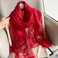 Detail view of red silk wool scarf featuring golden floral embroidery and organza stitching - 195CM / Wine Red