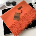 Vibrant orange faux cashmere scarf with tassels and leather patch detail - Orange Red